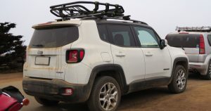 A 2018 Jeep Renegade on a dirt road.