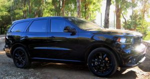 A black 2018 Dodge Durango parked in the woods.